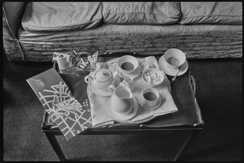 Coffee table with a breakfast tray and a map of London.