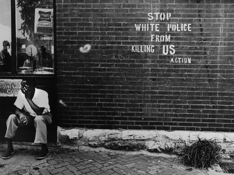 Darryl Cowherd, Stop White Police from Killing Us – St. Louis, MO, c. 1966-67. Gelatin Silver Print, 15 x 19 in. © Darryl Cowherd image courtesy of the artist and the Museum of Contemporary Photography