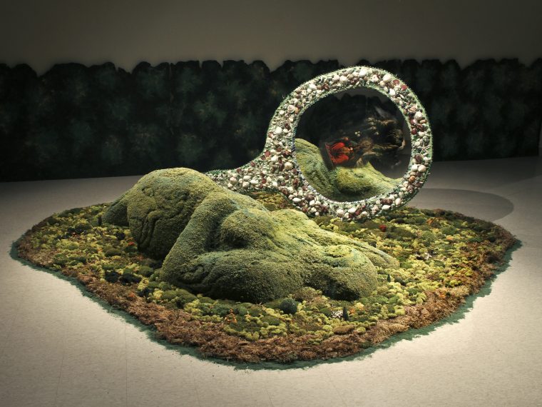 Amalia Mesa-Bains, Cihuateotl with Mirror in Private Landscapes and Public Territories, 1998-2011. Mixed media installation including painted and mirrored armoire, found objects, moss, dried flowers, faux topiaries, family photographs, miniature jeweled trees, painted wooden hedges; 180 in. diameter. Courtesy of the artist and Rena Bransten Gallery, San Francisco. Photo by Michael Karibian.