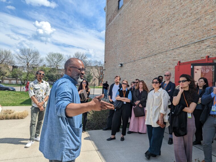 Artist Theaster Gates welcomes participants in the 2023 Curatorial Forum to the Stony Island Arts Bank, Chicago, IL. (Photo: Courtesy of ICI)