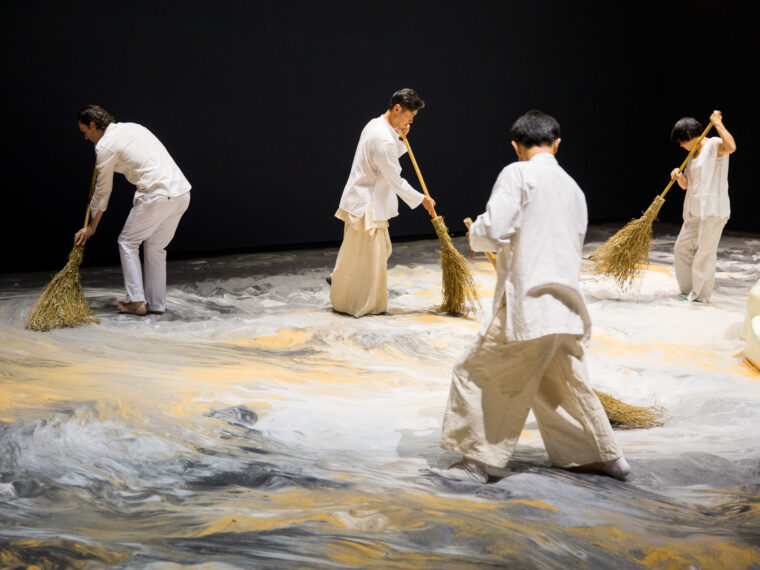Lee Mingwei, Guernica in Sand, 2006-present. Mixed media interactive installation: Sand, wooden island, lighting, 42.5 x 21 ft. Photo Courtesy of Taipei Fine Arts Museum