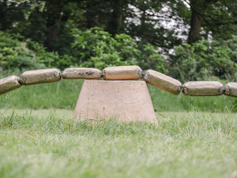 .Temitayo Ogunbiyi, You will make wishes for your neighbor (54 Days), 2024. Copper alloy, laterite, concrete. Dimensions variable. Commissioned by the Middelheim Museum, Antwerp, Belgium. Photo by Léonard Pongo. Courtesy of Temitayo Ogunbiyi