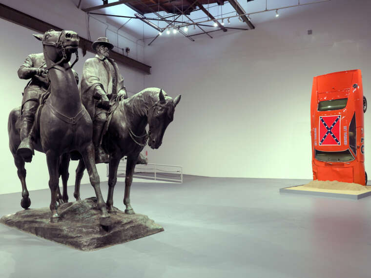 Laura Gardin Fraser, Robert E. Lee and Stonewall Jackson, 1948 (left). Bronze 167 x 192 x 116 in. Hank Willis Thomas, A Suspension of Hostilities, 2019 (right). 1969 Dodge Charger, 178 x 76 5/8 x 55 in. Photo by Stefanie Keenan for Getty Images.