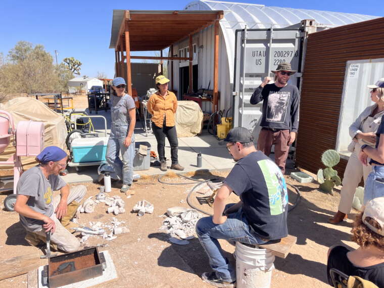 Artists in residence and workshop participants gather for a hands-on mold-breaking demonstration at Yucca Valley Material Lab. 