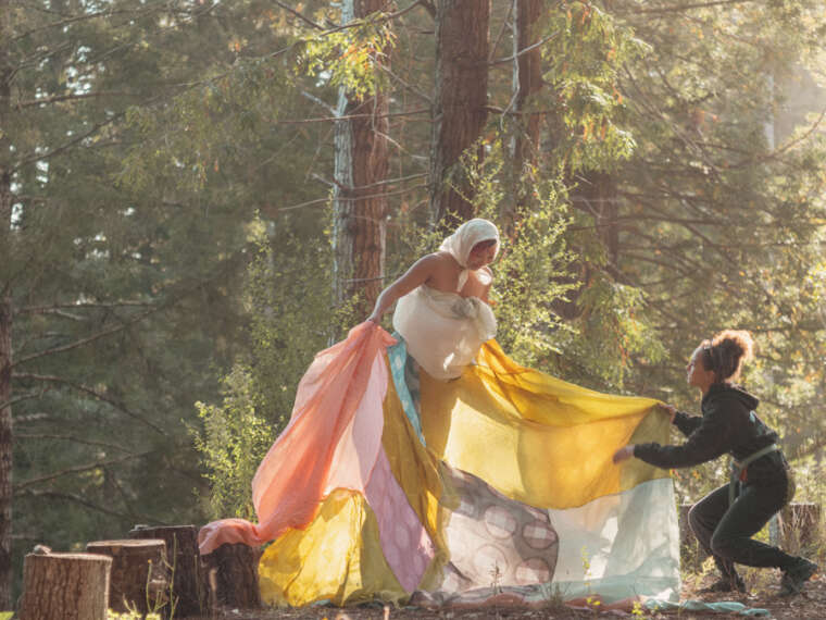 Misa Chhan performing with plant dyed silk sculpture at Salmon Creek Farm. Assisted by Anaïs Cooper-Hackman. Photo by Matthew Morrocco.